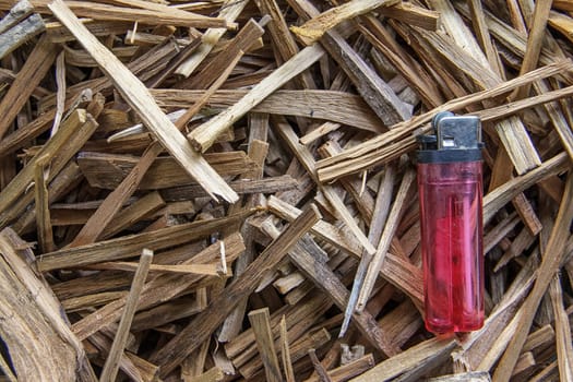 firewood and red lighters for kindle before Cooking