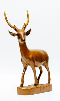 the Carved wooden deer with white background