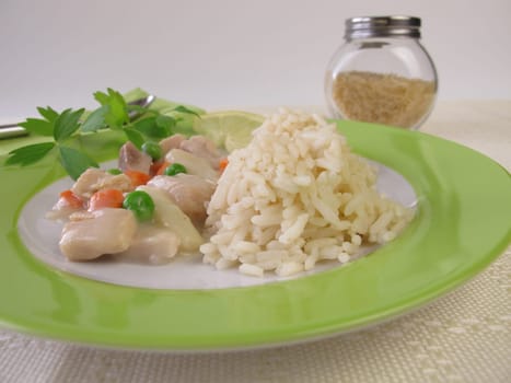 Chicken frying with carrots,peas and asparagus