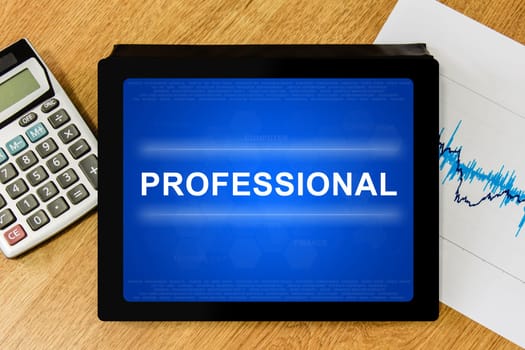 professional word on digital tablet with calculator and financial graph