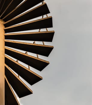 Brown metal spiral staircase pattern with iron railing for Decoration exterior on sky background. Spiral wrought steel staircase circular staircase with Copy space for design, Selective focus.