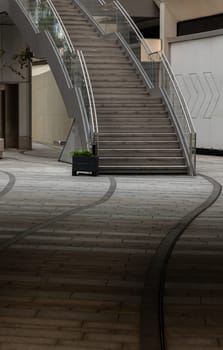 London, UK - Oct 13, 2023 - View of an external modern staircase with stainless steel railing handle grip and glass. Interesting architectural elements, Copy space, Selective focus.