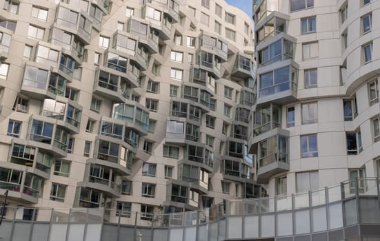 London, UK - Oct 16, 2023 - Geometric design on a modern building complex with repeating structure. Exterior architecture of modern building, Space for text, Selective focus.