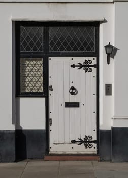 London, UK - Oct 24, 2023 - Front door of a house in De Vere Cottages and street light at South Kensington. Space for text, Selective focus.