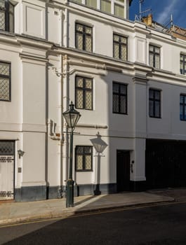 London, UK - Oct 24, 2023 - The shadow of the Street light in front of House in De Vere Cottages at South Kensington. Space for text, Selective focus.