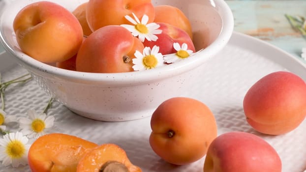 Delicious ripe apricots fruit on wooden background close up.