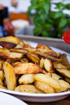 Closeup of plate of thickly cut French fries