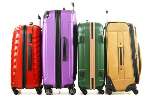 Four suitcases isolated on white background