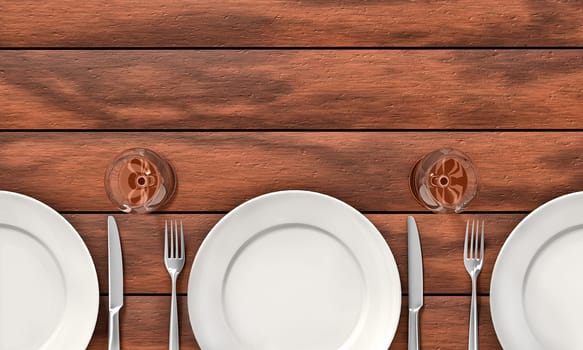 Knife, fork, glasses and white dishes on the dining table