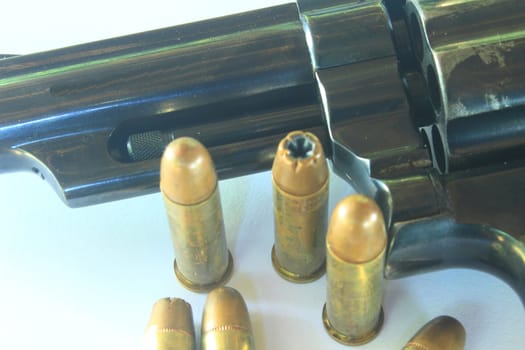 close up Gun with ammunition on white background