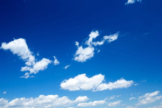 Blue sky background with a tiny clouds