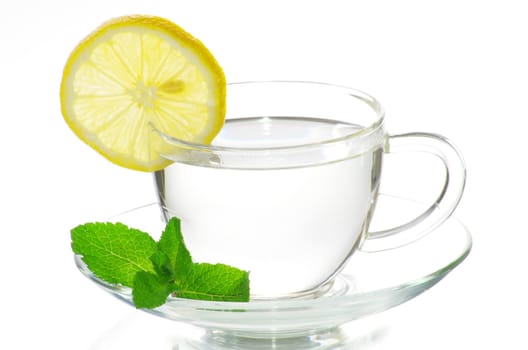 tea in cup with leaf mint and lemon