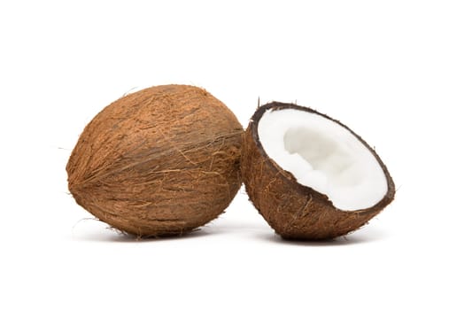 coconut cut in half on white background