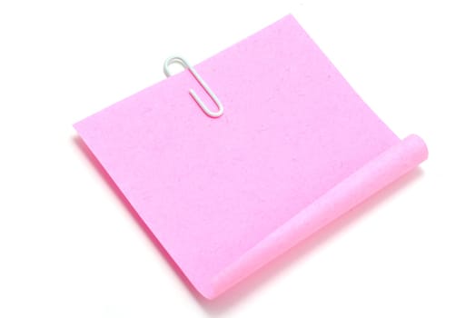 Blank note paper and red paper-clip isolated  on white