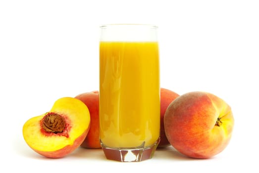 Glass with freshly made peach juice on a white background