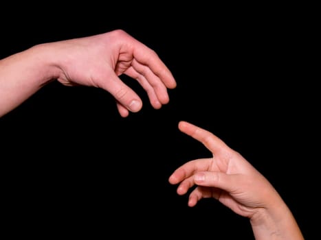 Helping hand  on black background