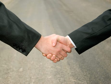 handshake on a grey background
