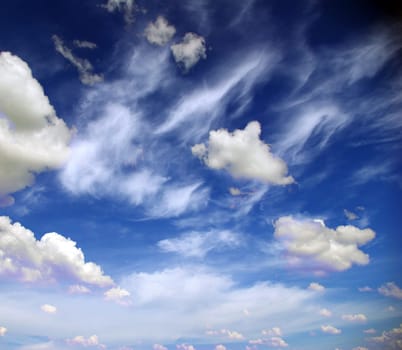 Blue sky background with a tiny clouds