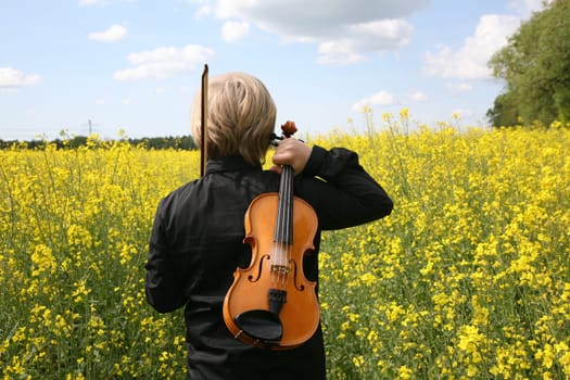 Boy from behind with violin
