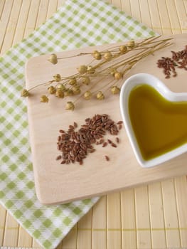 Linseed oil in a small heart-shaped porcelain bowl