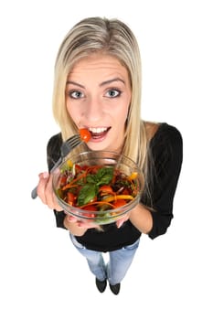Beautiful slim girl eating fresh salad - isolated on white