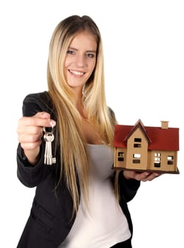 Pretty smiling estate agent woman with keys and model house