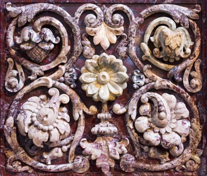 Marble bas-relief with floral motif, background