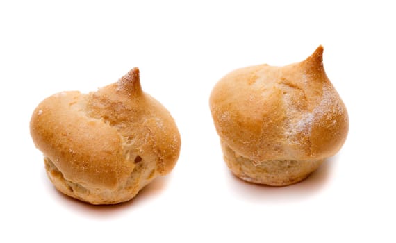 Two Cake profiteroles. Isolate on white.