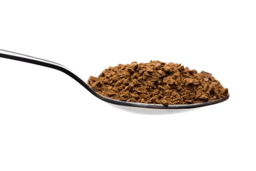 Instant coffee on a spoon. Isolate on white.