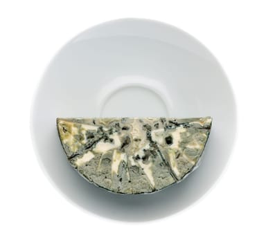 Cheese with black mold on the plate. Isolated on white background. View from above.