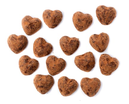 Chocolates truffles in bulk on a white background for Valentine's Day.