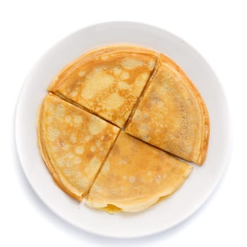 Pancakes stacked on a plate. Isolate on white.