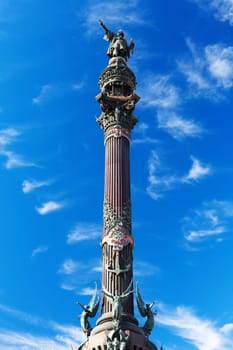 Statue of Christopher Columbus against a blue sky.
