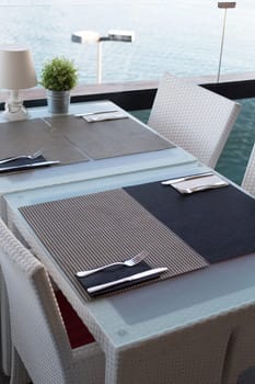 Empty table restaurant overlooking the Mediterranean Sea