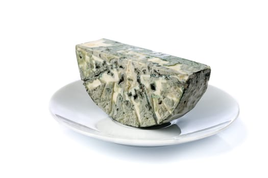 Cheese with blue mold on the plate. Isolate on white.