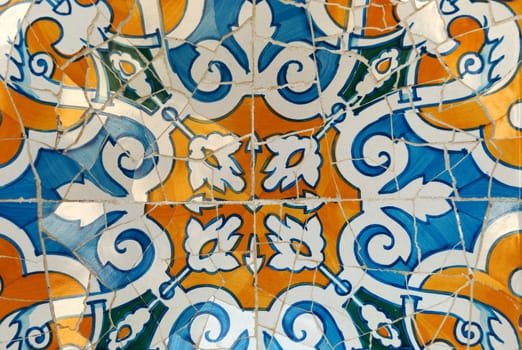 Detail of a mosaic on the wall. Guadi in park Guell Barcelona, Spain
