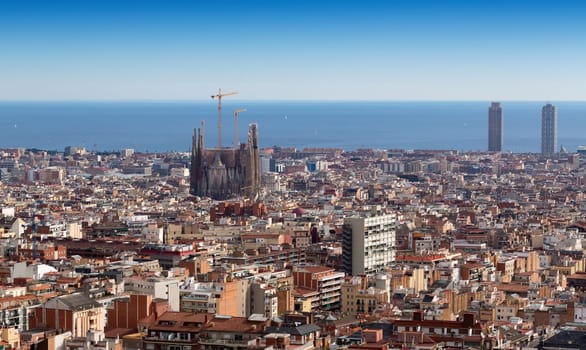A skyline of Barcelona with a view of Tibidabo mountain.