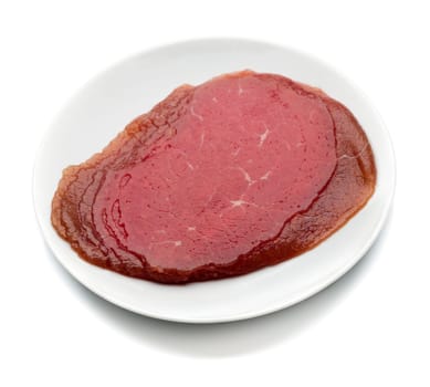 Appetizing smoked meat on the plate. Isolate on white.