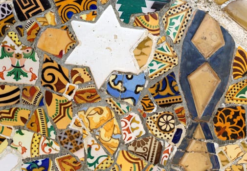 Close-up of the ceramics in Park Guell Barcelona created by Antonio Gaudi.
