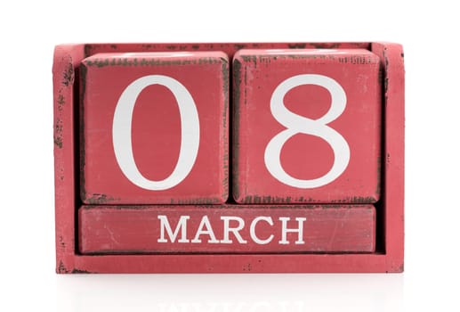Red wooden calendar, March 8. Isolate on white.