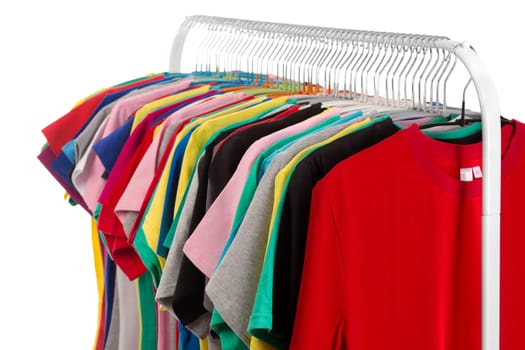 Colored shirts on hangers steel. Isolate on white.