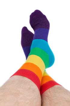 Mens hairy legs in colored striped socks fun. Isolate on white.