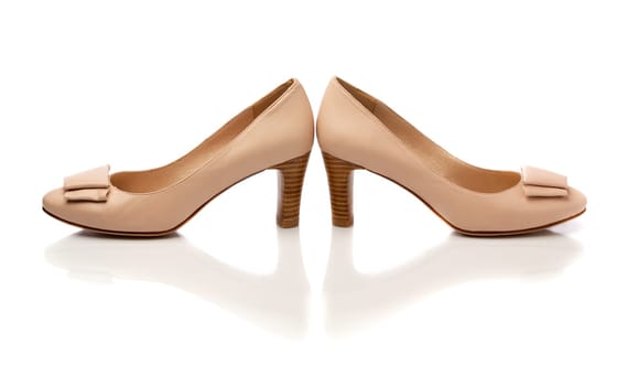 Pair of beige leather fashion women's shoes. Isolate.