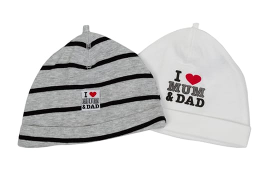 Two children's hats with the inscription "I love my mom and dad"""