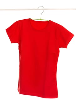 Red t-shirt with clothes hanger isolated on white.