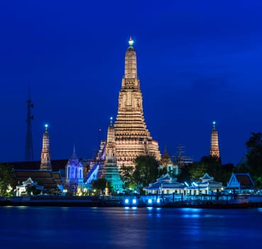 Famous Thai pagoda of Wat Arun illuminated at twilight, Thailand