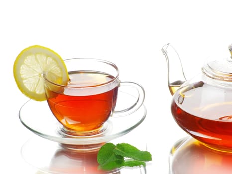 Tea being poured into glass tea cup
