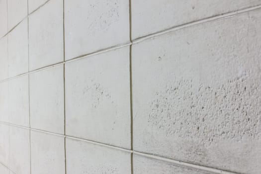 the gray, white texture of brick block cement wall