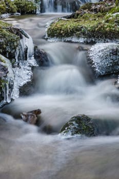 Small creek with a waterfall close up