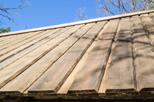 Roof farmhouse dwelling hewn planks close up